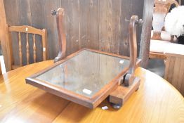 A Victorian mahogany dressing table mirror havig shaped supports and platform base, approx. 49 x