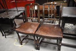 A pair of early 20th Century oak dining chairs