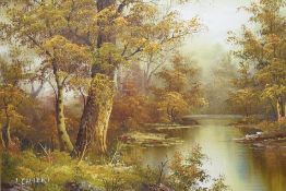 I. Cafieri (20th century) oil on canvas, autumnal woodland river scene, signed lower left, within