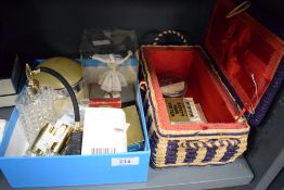 A vintage wicker sewing/jewellery basket, decorated having floral patterns within a purple border,