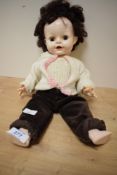 A vintage Pedigree plastic doll presented in a seated position , h24cm