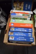 Nine assorted 500 piece jigsaw puzzles and a lap tray.
