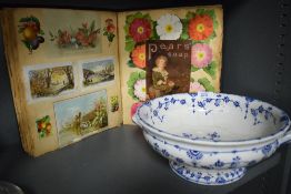 A vintage scrap book containing a large selection of cards and postcards sold along with a blue