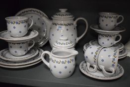 A Wiuterling ceramic tea service, decorated with daisies on a baby blue glaze ground, comprising