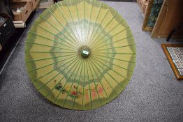 An attractive vintage parasol in the Chinese style, decorated on rice paper with birds and foliage