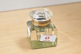 An early 20th century cut glass inkwell having yellow metal collar, h8cm