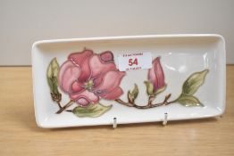 A Moorcroft pottery Magnolia pattern rectangular plate, impressed makers mark to base, L20cm