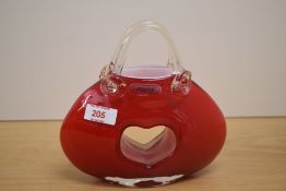 A Laguna red glass hand bag having central heart motif and makers label, h18.5cm