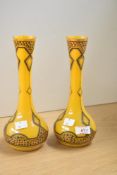 A pair of continental coloured glass baluster vases in the Art Nouveau style, decorated having