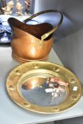 A brass convex porthole style mirror, w36cm, sold together with two corkscrews and a copper scuttle,