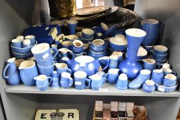 A large group of blue and white Devon studio pottery souvenirware, to include tea pot, vase, pots