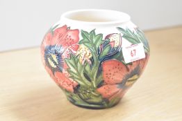 A Moorcroft pottery Pheasants eye pattern vase decorated with red and green foliage, date code for