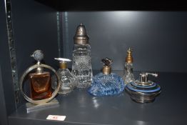 An Art Deco style glass perfume bottle having circular chrome surround, pat no. 281719 to base,