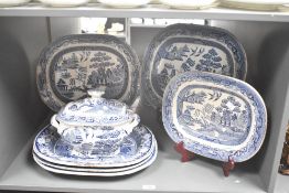 A Staffordshire blue and white Willow pattern ashette decorated with Chinese landscape scenes and