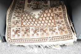 A pair of wool runner rugs having central diamond bordered with geometrical patterns, L142cm