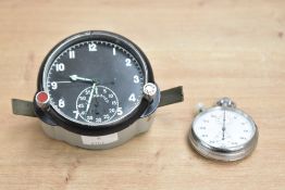 A vintage military aviation cockpit clock having black dial with luminous hands, h8.5cm, sold