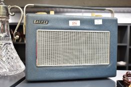 A vintage Hacker Sovereign transistor radio in blue colour having carry handle, L31cm