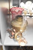 A early 20th century brass oil lamp, h 20cm, sold together with glass chimney, shade and ceiling