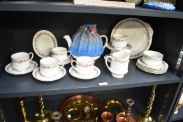 A Paragon Belinda fine bone china tea set, comprising six side plates, cups and saucers, cake plate,
