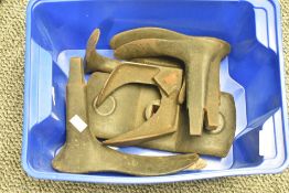 A box containing cast-iron cobblers shoe lasts, (6)