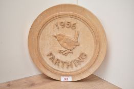 A circular wooden plaque having carved 'Farthing dated 1956', w26cm