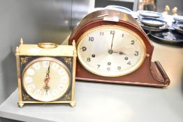 An early 20th century 8-day arched mahogany mantel clock, w33cm, sold together with a Quartz