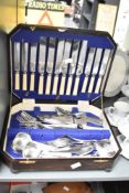 A vintage oak canteen containing Pedigree stainless steel cutlery, A/F