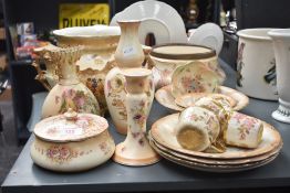 A Royal Worcester vase of bulbous form having shell shaped top, decorated with floral leaf and