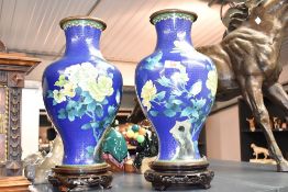 A pair of large and decorative Chinese cloisonné enamel baluster vases, decorated with blossoms
