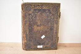 A 19th century Brown's Holy Family Bible bound in leather with metal clasps, h34cm