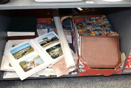 A souvenir scrap book containing various postcards, to include Southport, Ullswater, Torquay ect,