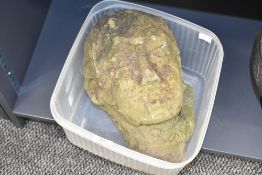 An interesting and early carved sandstone head, 27cm has been recently uncovered after being