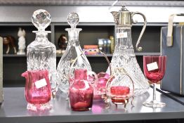 A vintage cut crystal claret jug having silver plated Bacchus spout and lid with scroll handle,