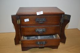 A 19th century mahogany three drawer Wellington Apprentice chest having brass handles and locking