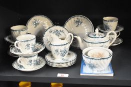 A Pembroke bone china childrens tea service decorated with blue foliage on a white ground, sold