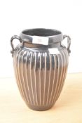 A Chinese Cizhou black-glazed ribbed vase having twin reeded handles, h21cm Condition report: