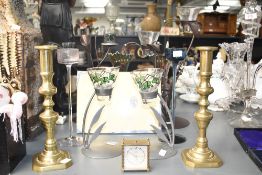 A pair of brass candlesticks, h29cm, sold together with a Roamer clock, a Foframe frame ect