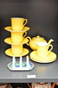 A Shelley fine bone china tea service, decorated with gilt edging on a yellow ground, comprising