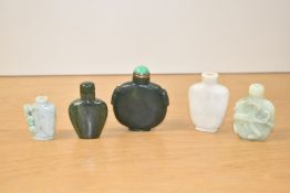A group of 5 Chinese carved stone snuff bottles, (5)