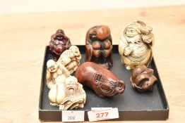 A Japanese carved wooden snake Netsuke Ojime ball, signed to base, h3.5cm, sold together with a