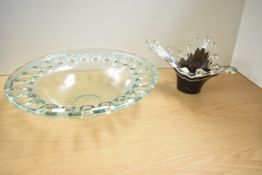 A large contemporary open work thick glass bowl, w41cm, sold together with a splash glass vase,