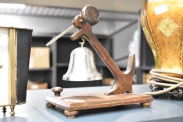 A 20th century oak butler's service bell, the support in the form on an anchor, h17cm