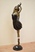 An attractive Art Deco style patinated metal figure of a female dancer, h49cm