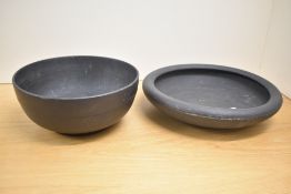 A large late 19th / early 20th century Wedgwood black basalt bowl, impressed makers mark to base,