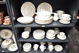 A Royal Doulton Mystique pattern dinner service, decorated with floral patterns on a white glazed