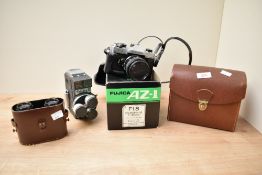 A vintage Holiday II camera with 8mm flash, sold together with a pair of binoculars and a Fujica