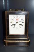 A 19th century French mantel clock, by Martin Baskett, Paris, having a brass carrying handle over