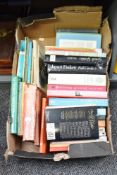 A box containing various novels, to include An Awfully Big Adventure by Beryl Bainbridge, Great
