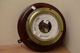 A German mahogany mounted brass barometer by C Plath, Hamburg, the circular dial with scale and