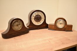 A early 20th century arched mantel clock having brass dial and Roman numerals, L27cm, sold